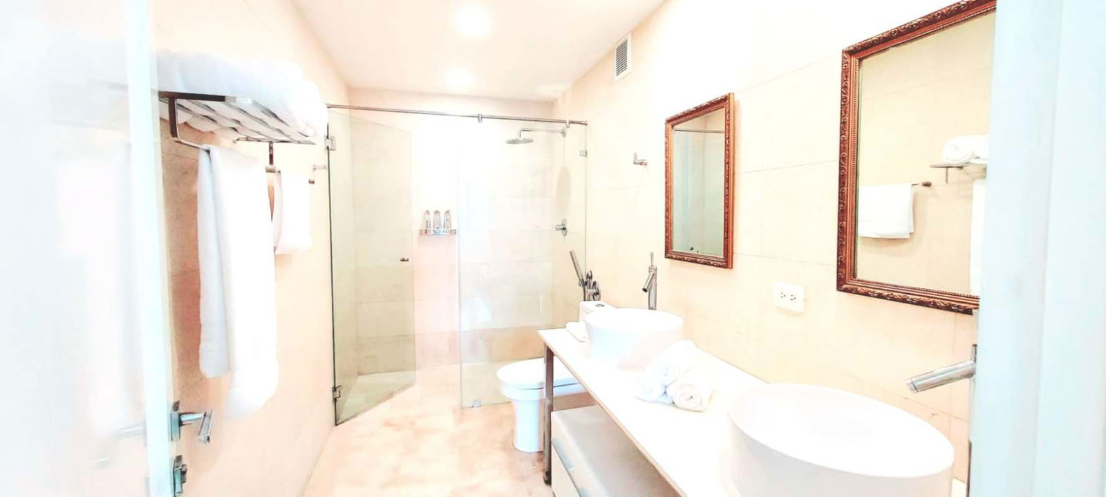 Modern bedroom with tufted bed, workspace, city and sea views PH Yoo Panama