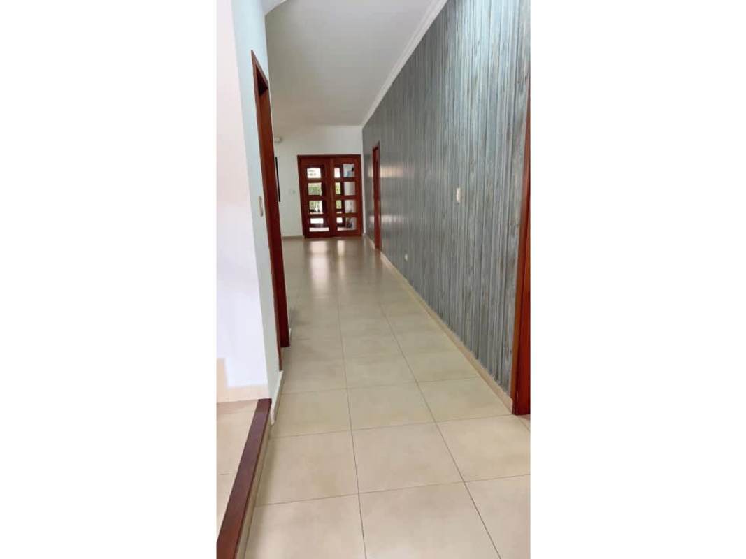 Covered outdoor terrace with columns and greenery Costa Sur Panama home for sale