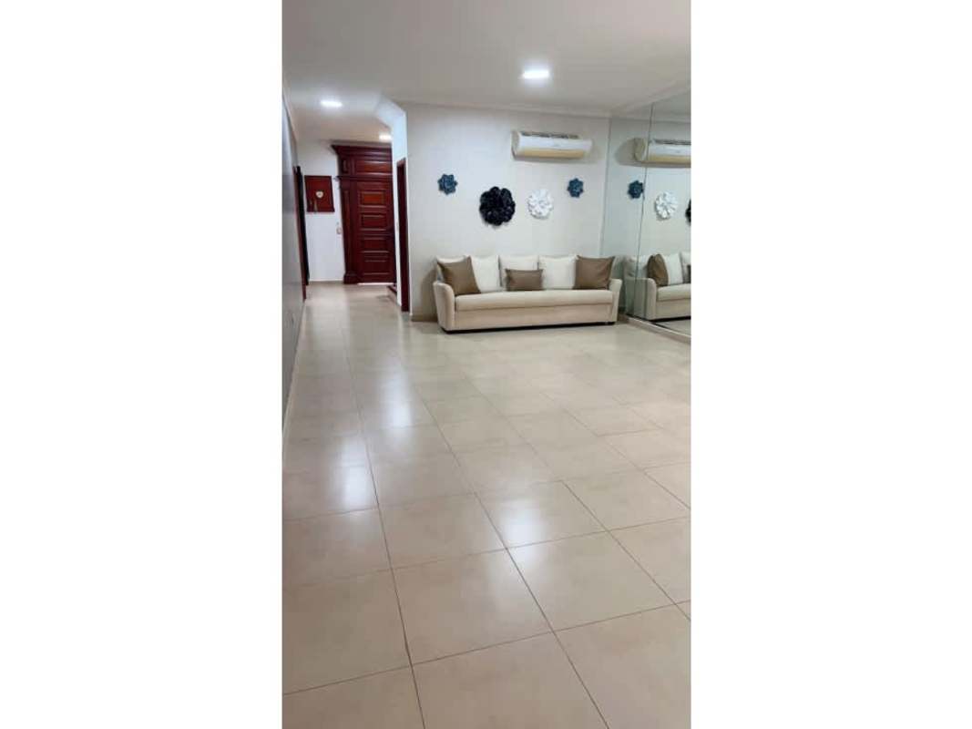 Open plan dining and living area with full mirror wall Costa Sur home for sale