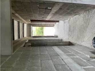 Unfinished interior of rural house with exposed concrete walls and large window near Penonomé Panama