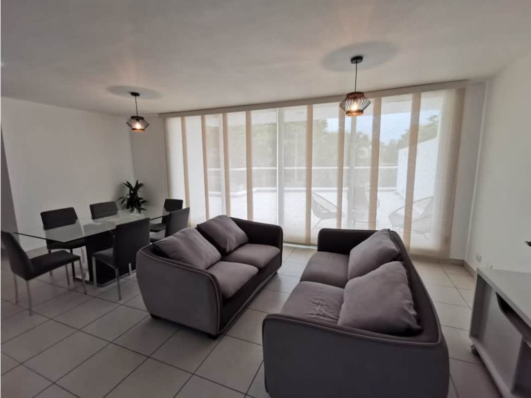 Expansive outdoor terrace with glass railing and garden views in PH Clayton Park II Clayton Panama