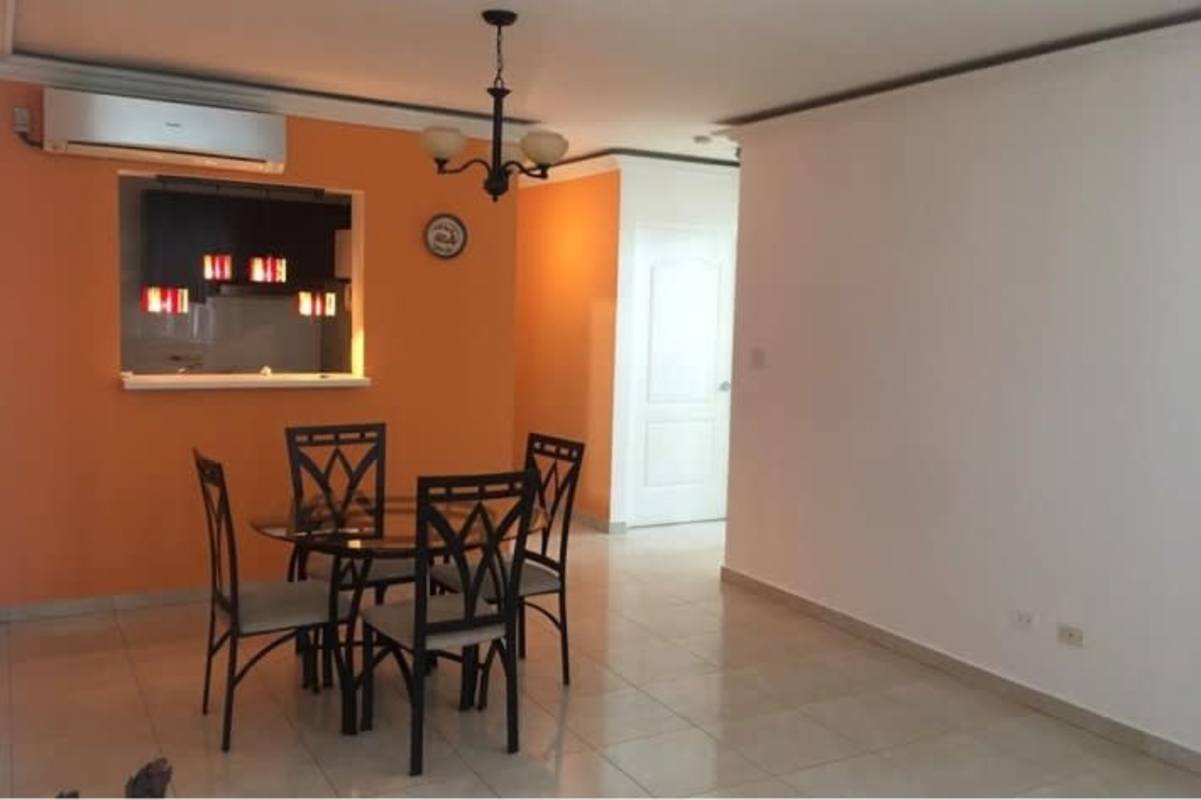 Modern kitchen with dark cabinets, white countertops, gas stove, refrigerator PH Vivendi Towers Panama