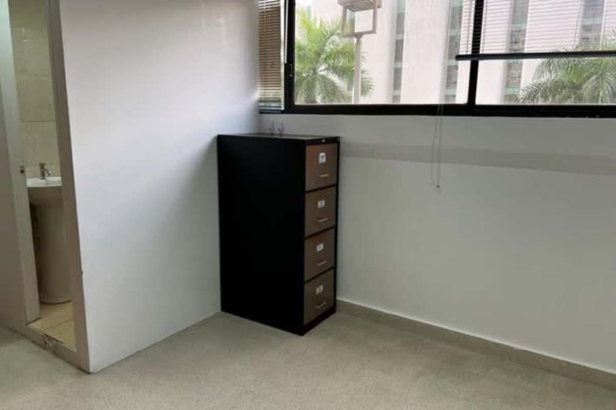 Minimalist bright doctor office space view with window blinds and attached washroom