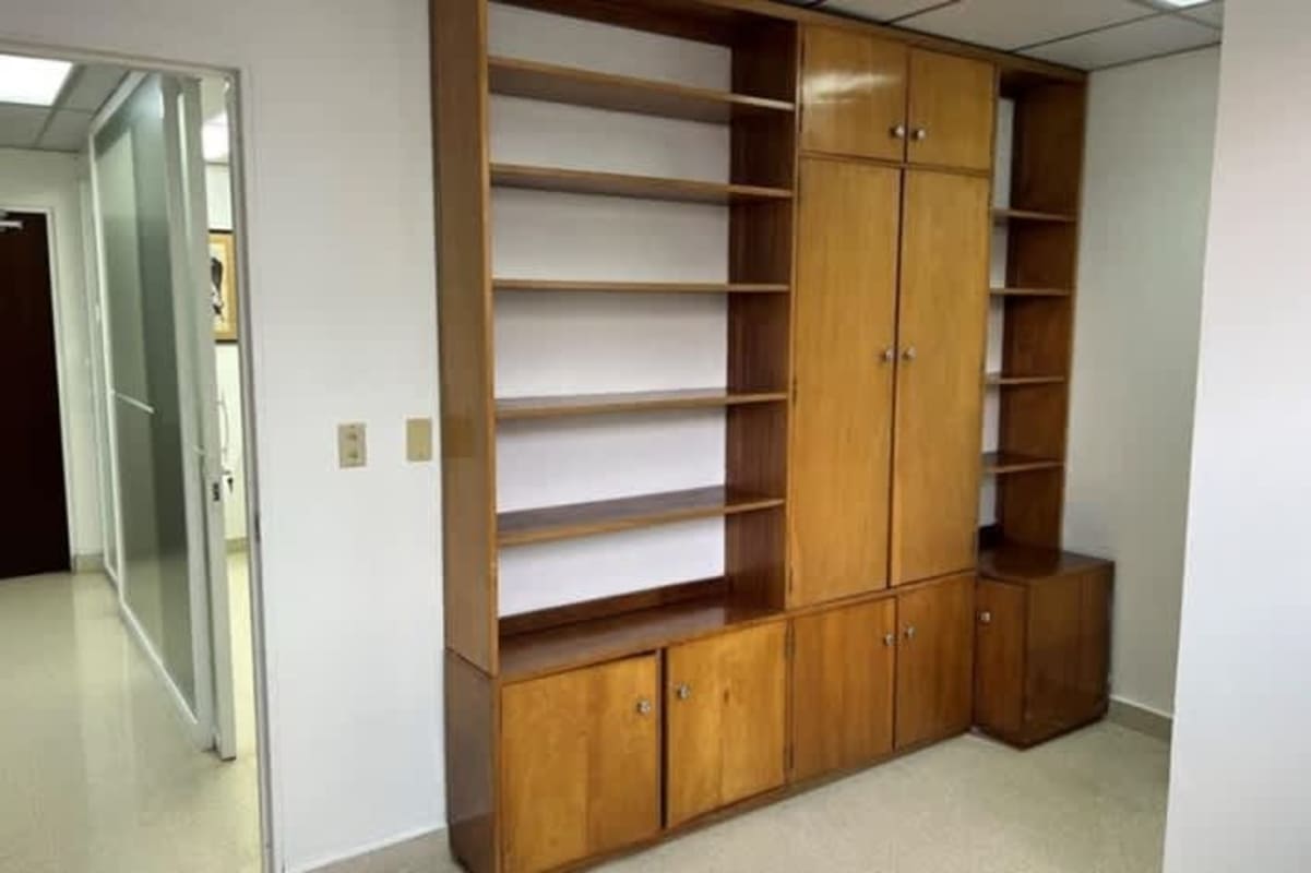 Mid-century style medical office with wood shelving and cabinets in Paitilla Panama