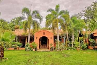 Octagonal swimming pool with fountain, pergola, tropical landscaping Estate Las Palmas Gorgona Panama
