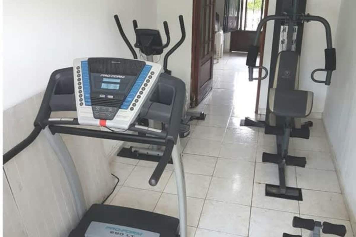 Covered patio terrace with outdoor bar, barbecue grill, ceiling fans in Mediterranean home Panama Norte