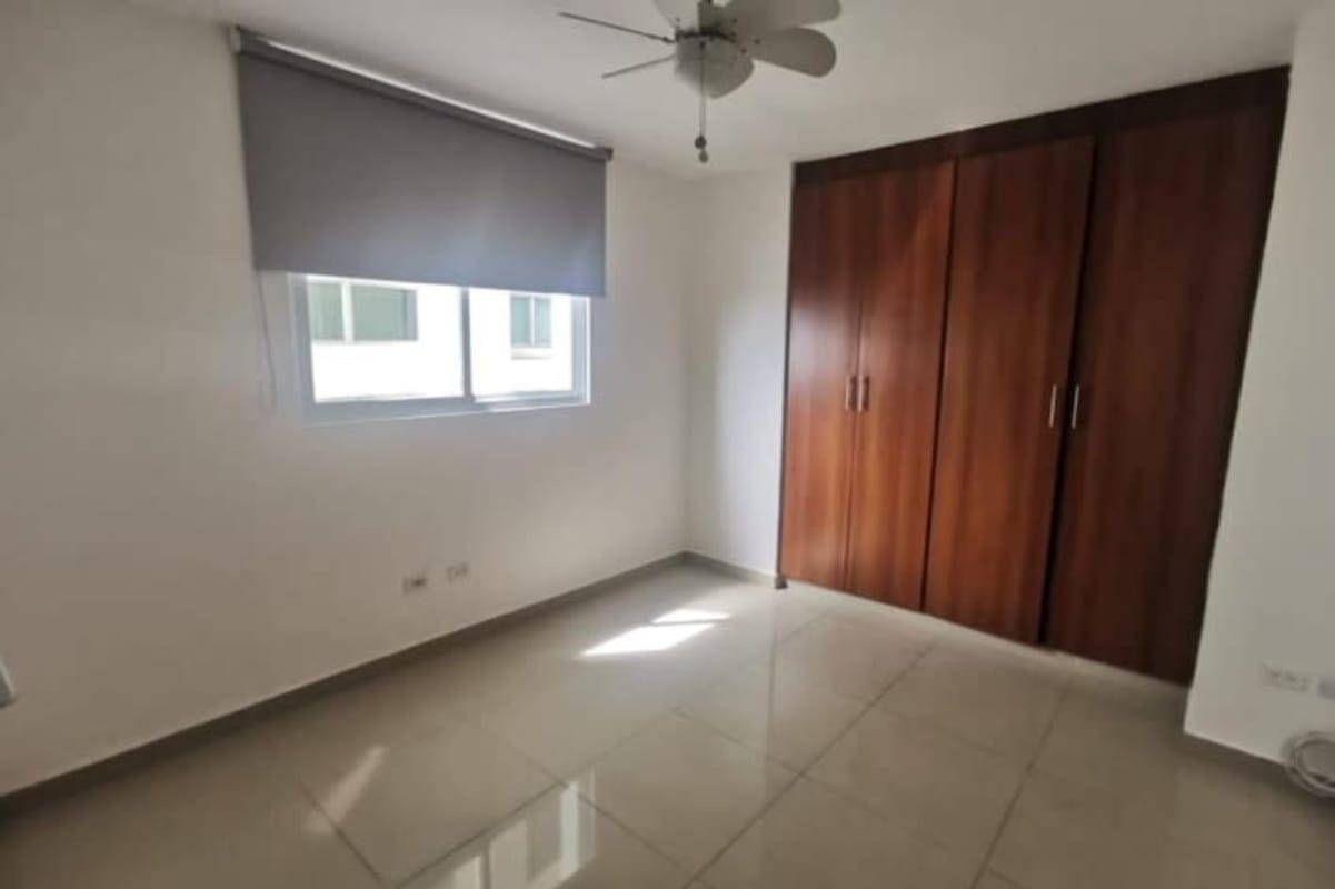 Master bedroom with large window, ocean view, ensuite bath in PH Quartz Tower Panama