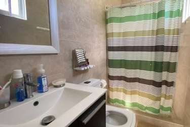 Bedroom featuring mandala wall art, sliding glass and modern furnishings in Ibiza Residences Panamá