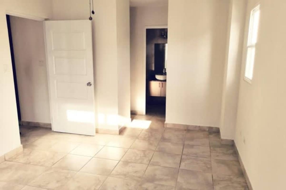 Bedroom featuring closet, split air conditioner, ceiling fan in PH Everest home