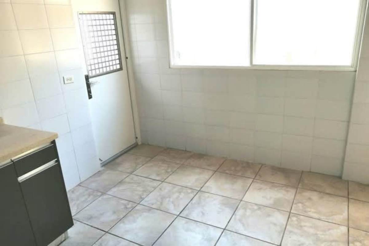 Modern minimalist kitchen with cabinets, countertops, window PH Everest Brisas del Golf