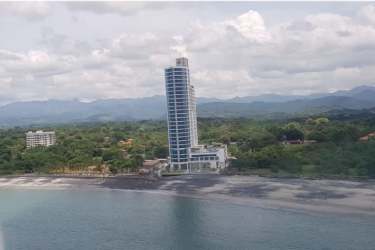 Modern open-concept living area with kitchen and stylish decor in Royal Palm Playa Gorgona Panama