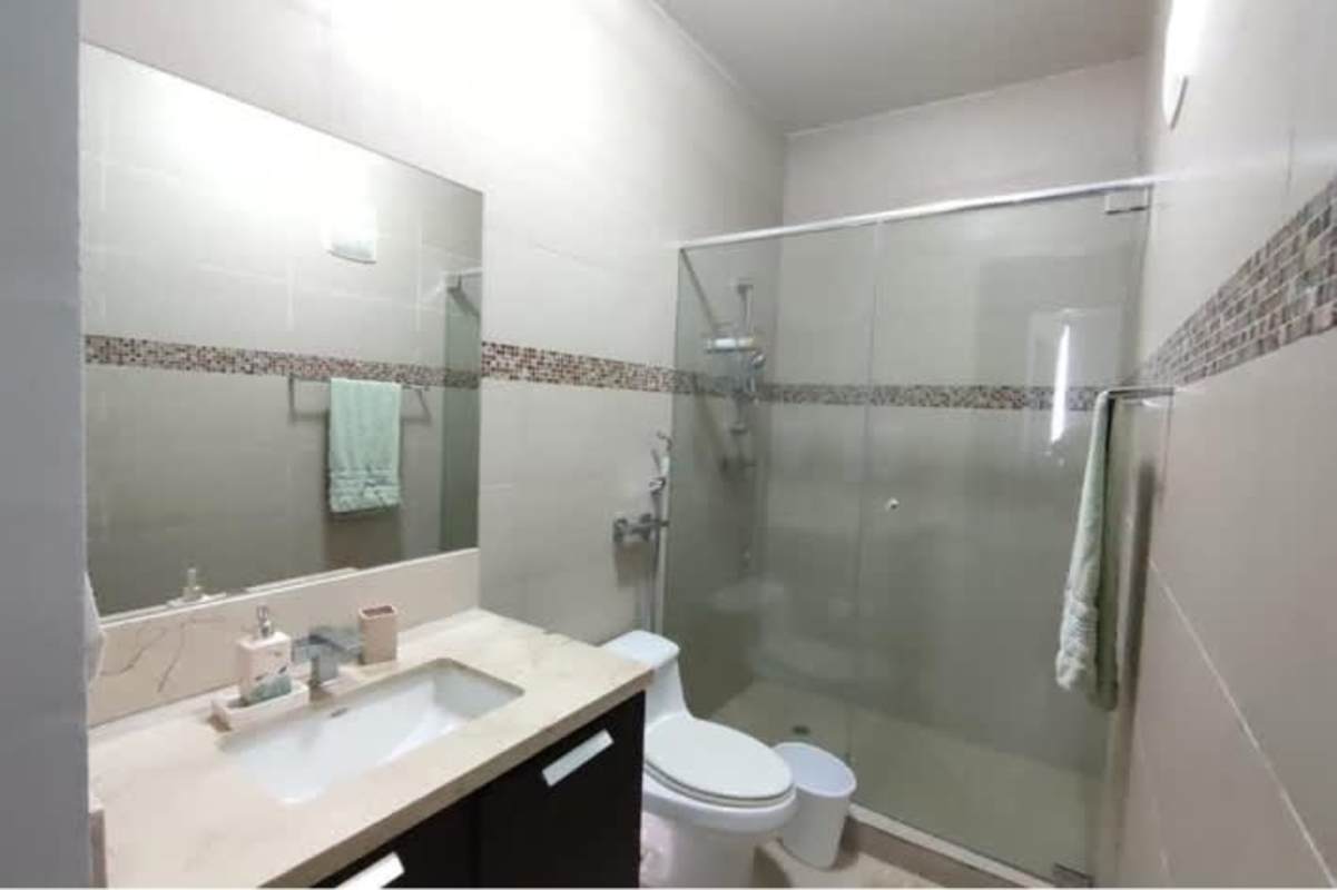 Marble bathroom with glass shower in studio condo Trump Ocean Club Panama