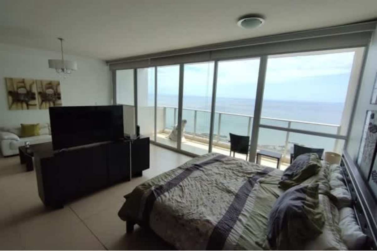 Modern open kitchen with dining in luxury Trump Tower studio Punta Pacifica