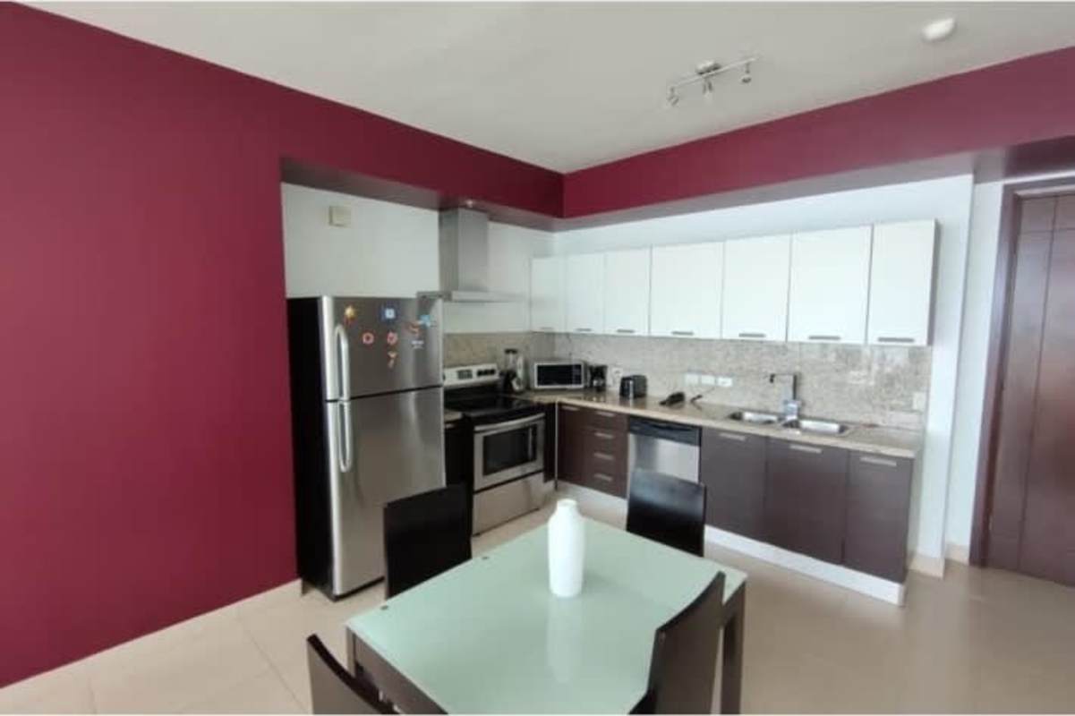 Fully equipped modern kitchen and dining in studio condo Trump Tower Panama