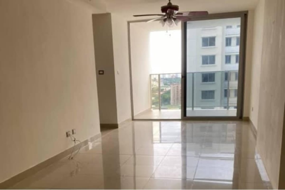 Spacious living room with sliding glass doors to balcony and city views in PH Rokas Condado del Rey