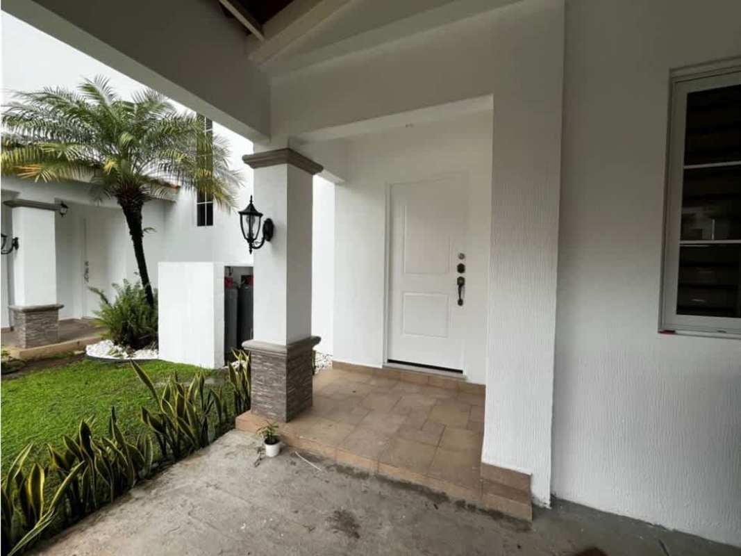 Kitchen with granite countertops, gas range, built-in oven and light wood cabinets in Costa Sur Panama