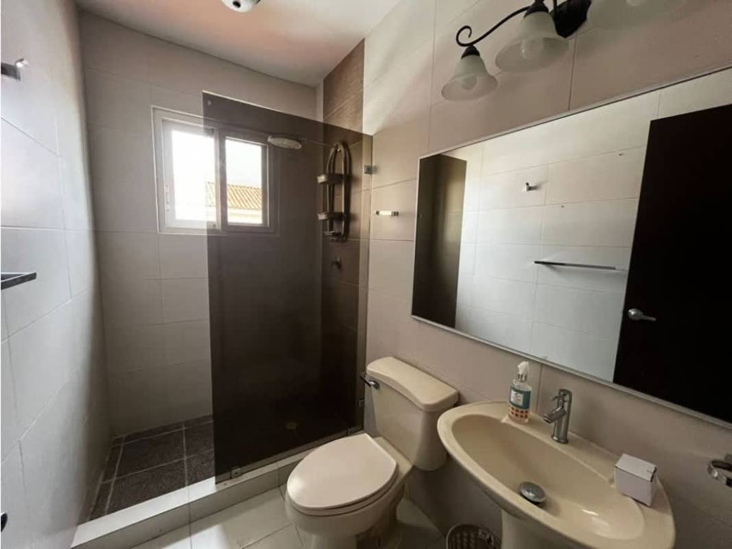 Contemporary bathroom with large mirror, double sink vanity and glass shower divider in Costa Sur Panama