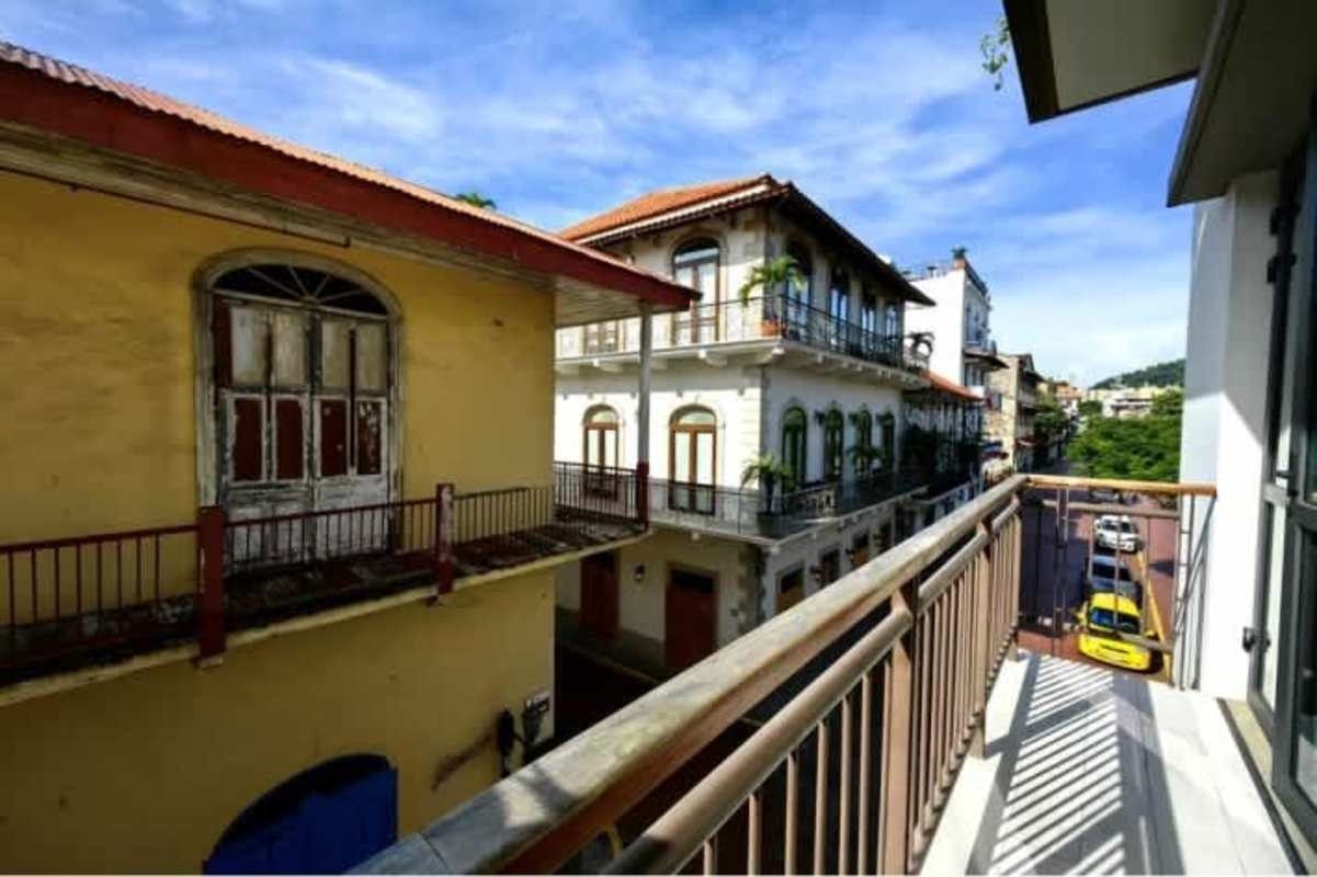 Narrow wrought iron balcony overlooking historic Plaza Herrera Casco Viejo at PH San Felipe Panama
