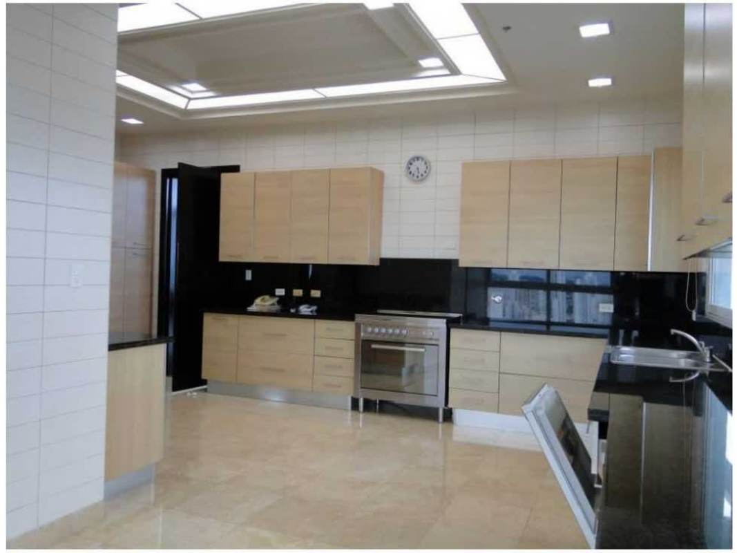 Family den with ocean views and terrace in Coco del Mar penthouse duplex