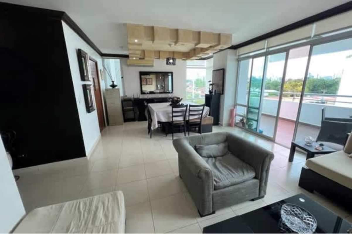 Open dining space adjacent to living room with balcony access PH Veranda Tower Panama City