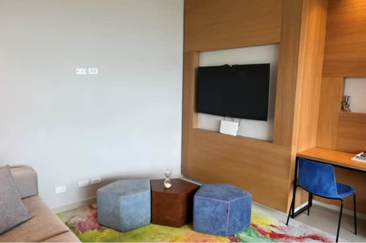 Bedroom with large glass window, minimalist decor and light colors in Costa del Este Panama