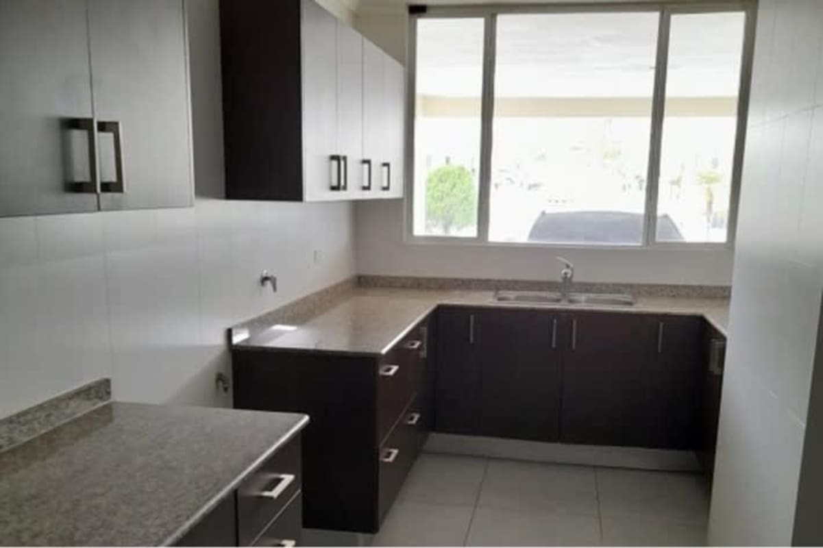 Kitchen with granite countertop, cabinets and window PH Brisas Point Brisas del Golf house Panama