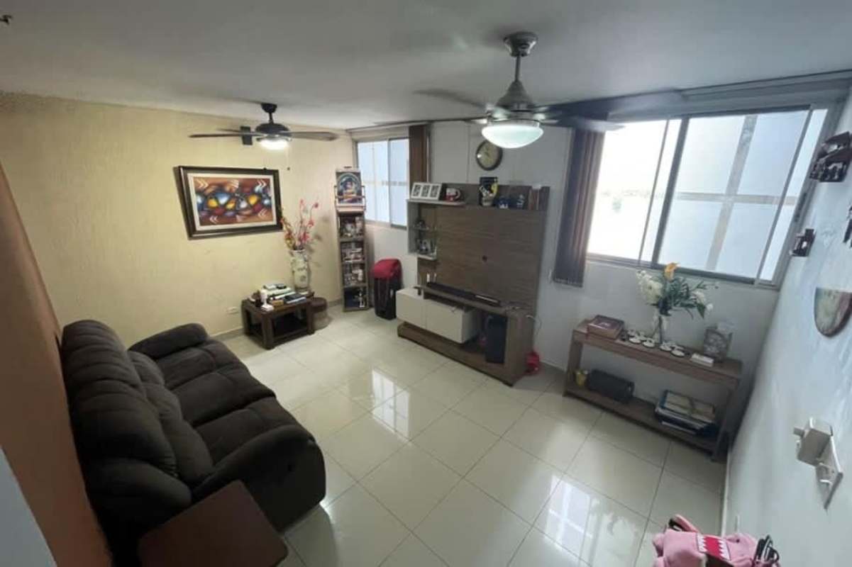 Bedroom with black wardrobe, desk, and light tile floor Parque Lefevre Panama