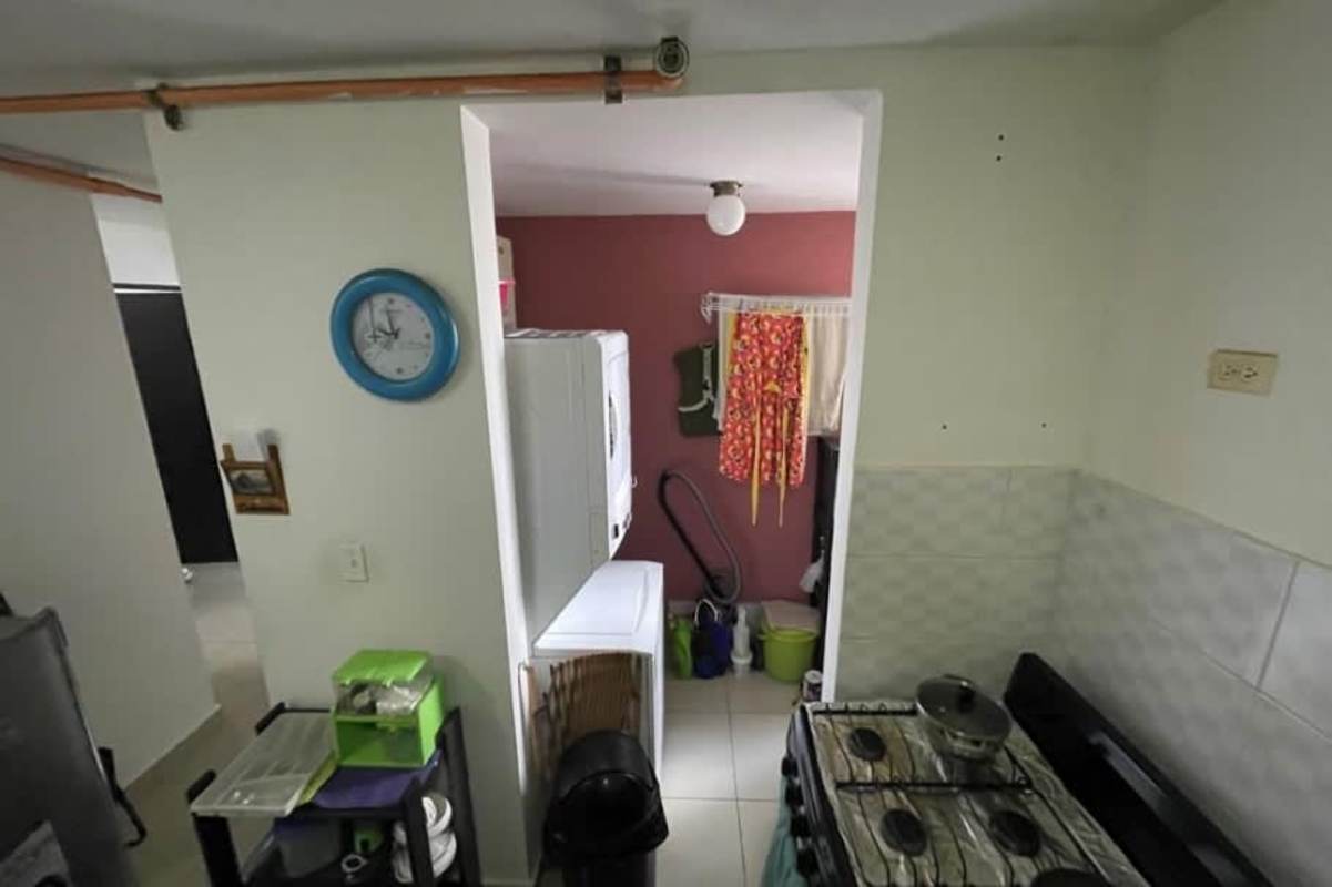 Minimalist bedroom with ceramic tile floor affordable condo Parque Lefevre Panama City