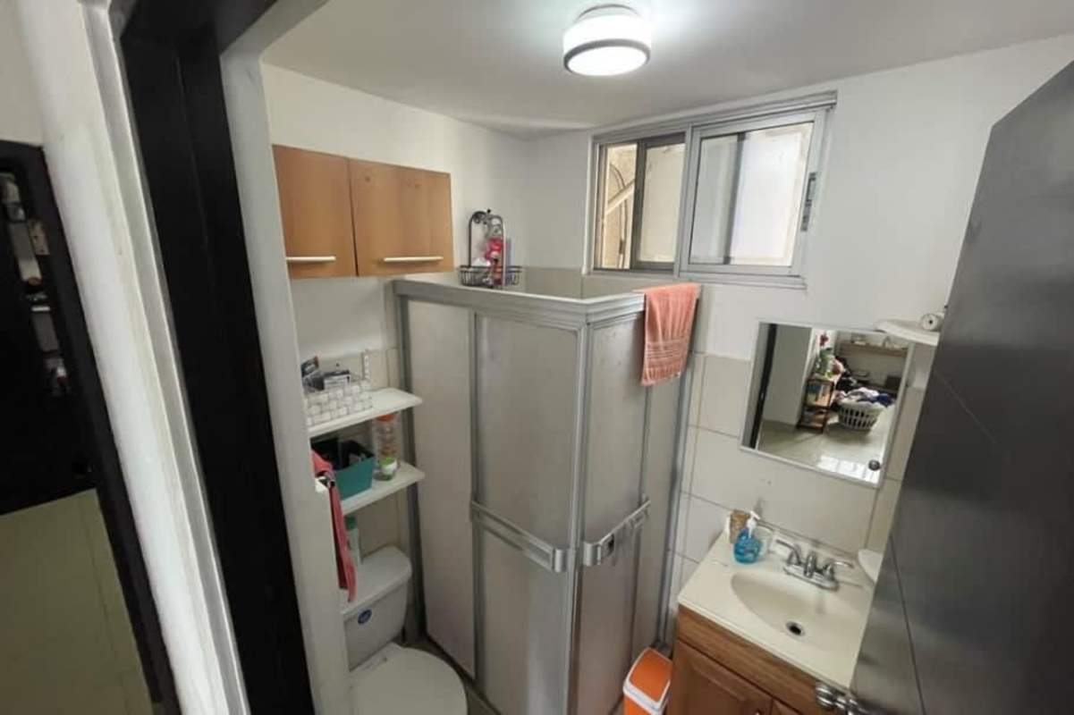 Compact kitchen with granite countertops, gas stove Parque Lefevre apartment Panama City