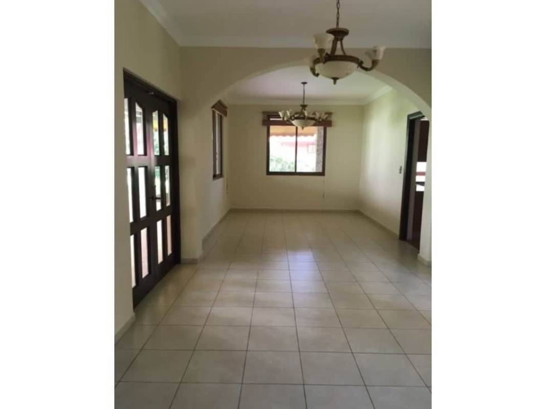 Bright living room with large windows tiled floors and classic design in Clayton
