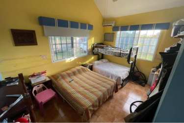 Bedroom with bunk bed, queen bed, AC unit in Nueva Gorgona Panama