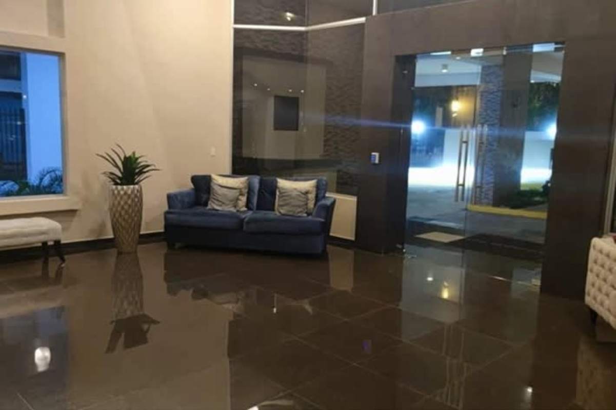 Modern kitchen with granite island and stainless appliances at PH Serenade San Francisco Panama