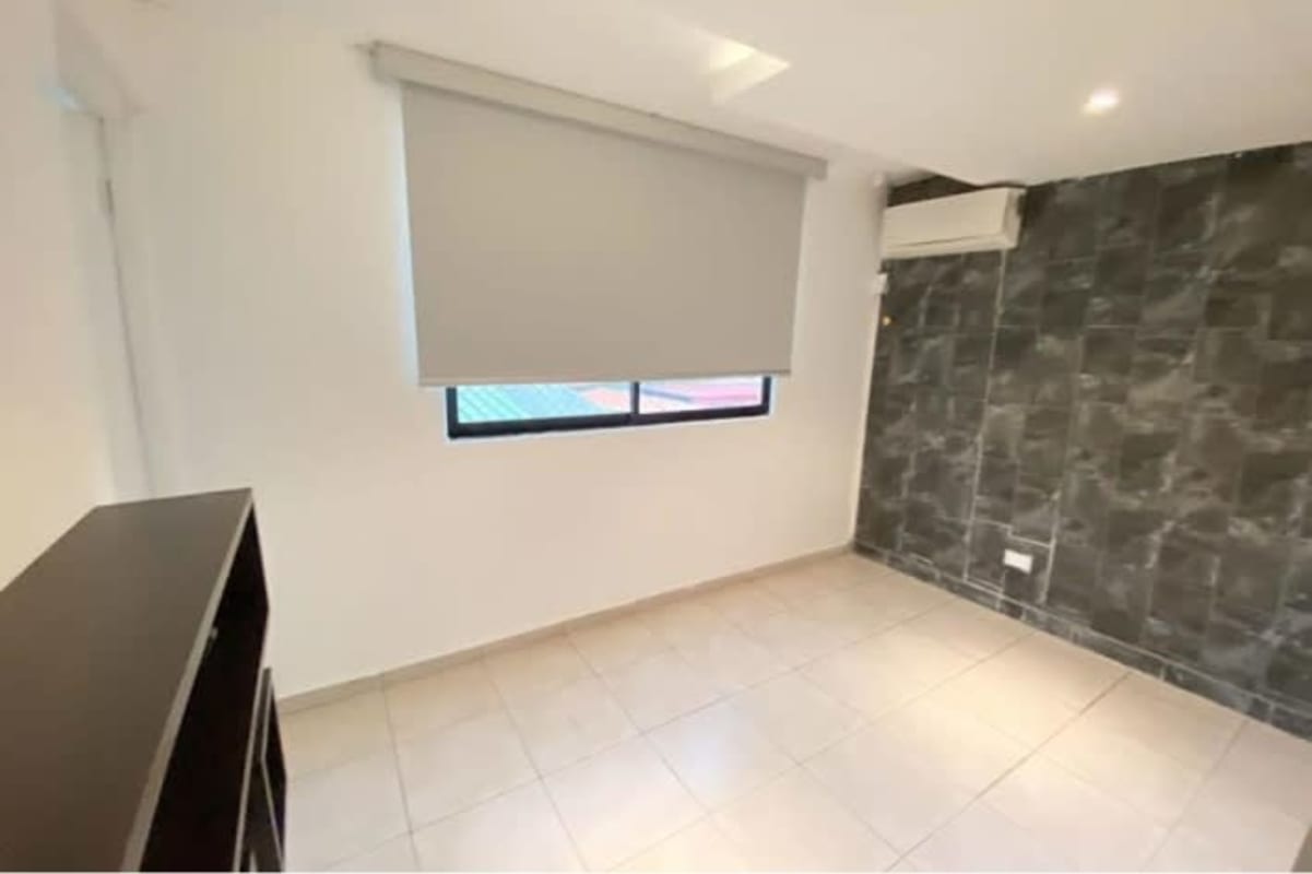 Large private terrace with artificial grass, planters, stone wall, panoramic city view in PH San Francisco Park Tower Panama