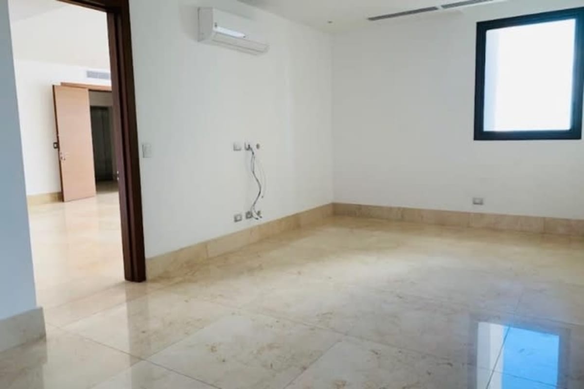 Bright spacious living room marble floors city and golf views PH Ocean House Santa María Panama