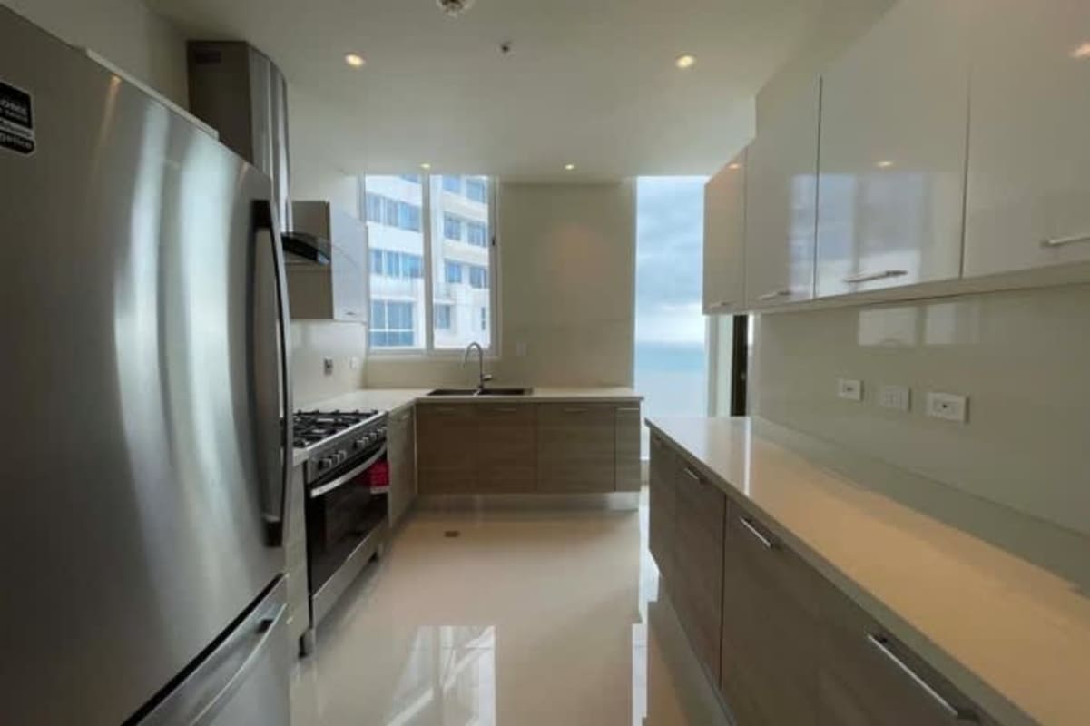 Dining area with modern decor large wall mirror pendant lighting PH Costa del Este Panama