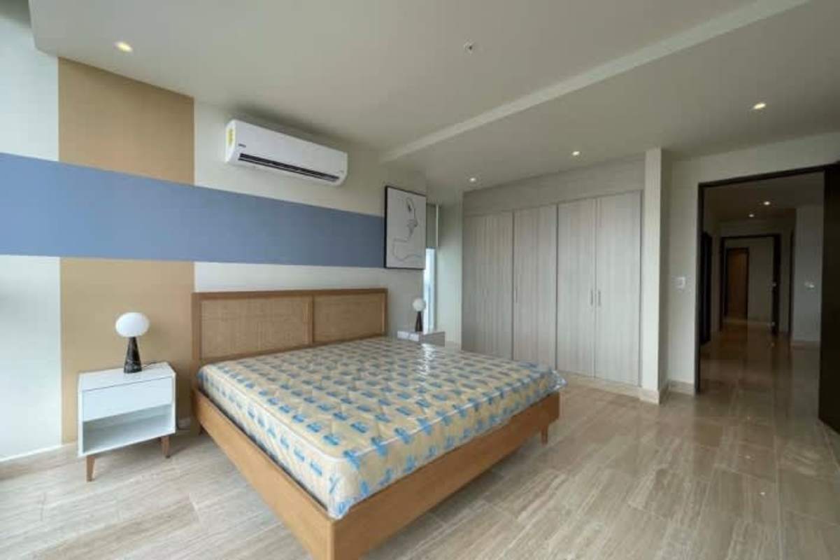 Kitchen with stainless steel appliances window ocean view white and wood cabinets in PH Costa del Este Panama