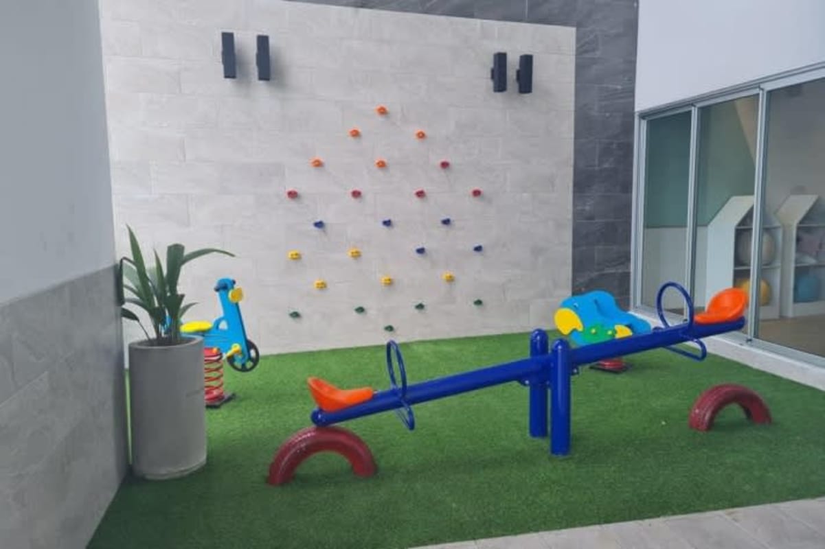 Elegant lobby with marble floors, large windows, contemporary decor at PH El Cangrejo Plaza Panama City