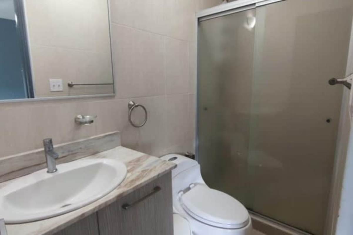 Second bedroom in Condado Country Club rental Condado del Rey Panama with closet and ceiling fan