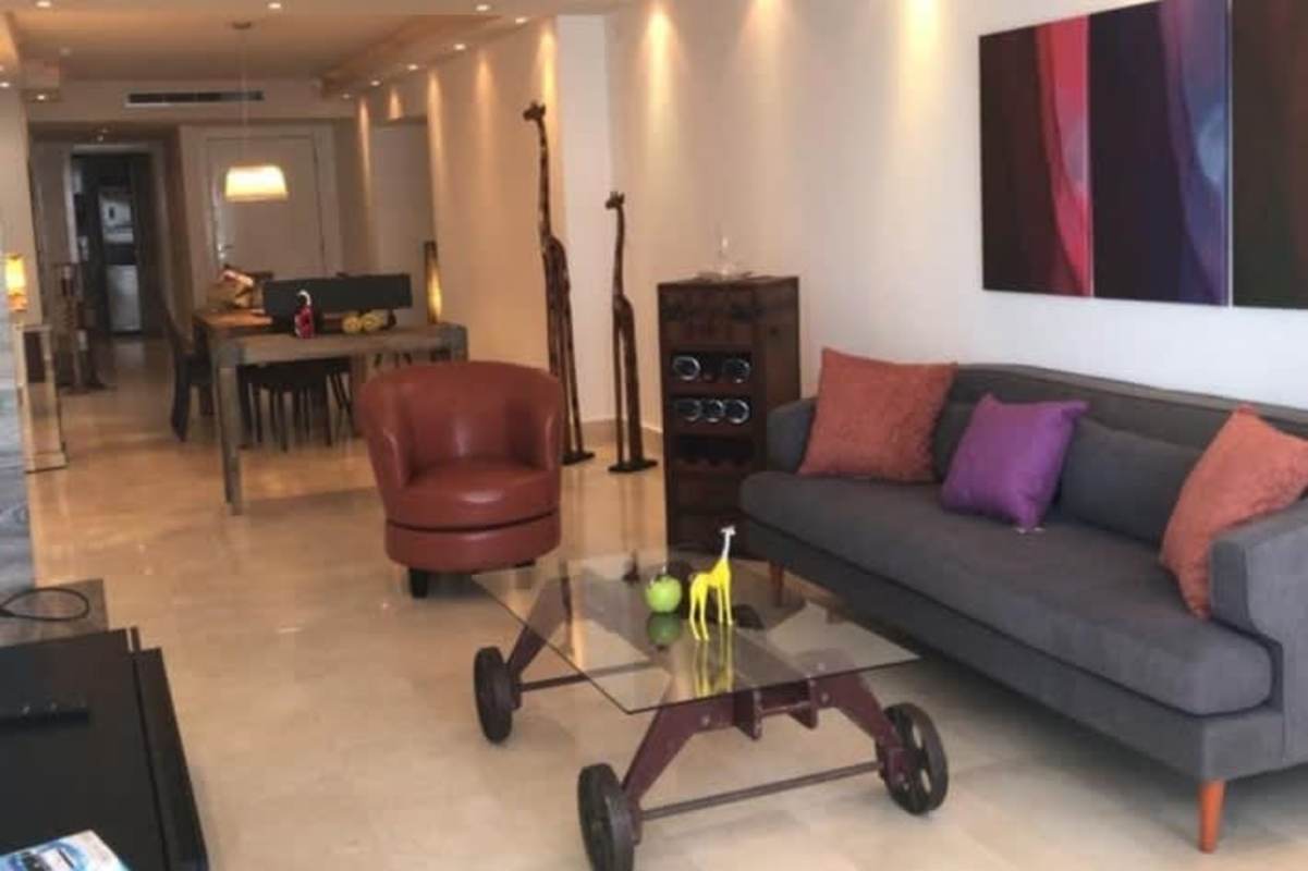 Bedroom with large window ocean views and modern furnishings in PH BICSA tower