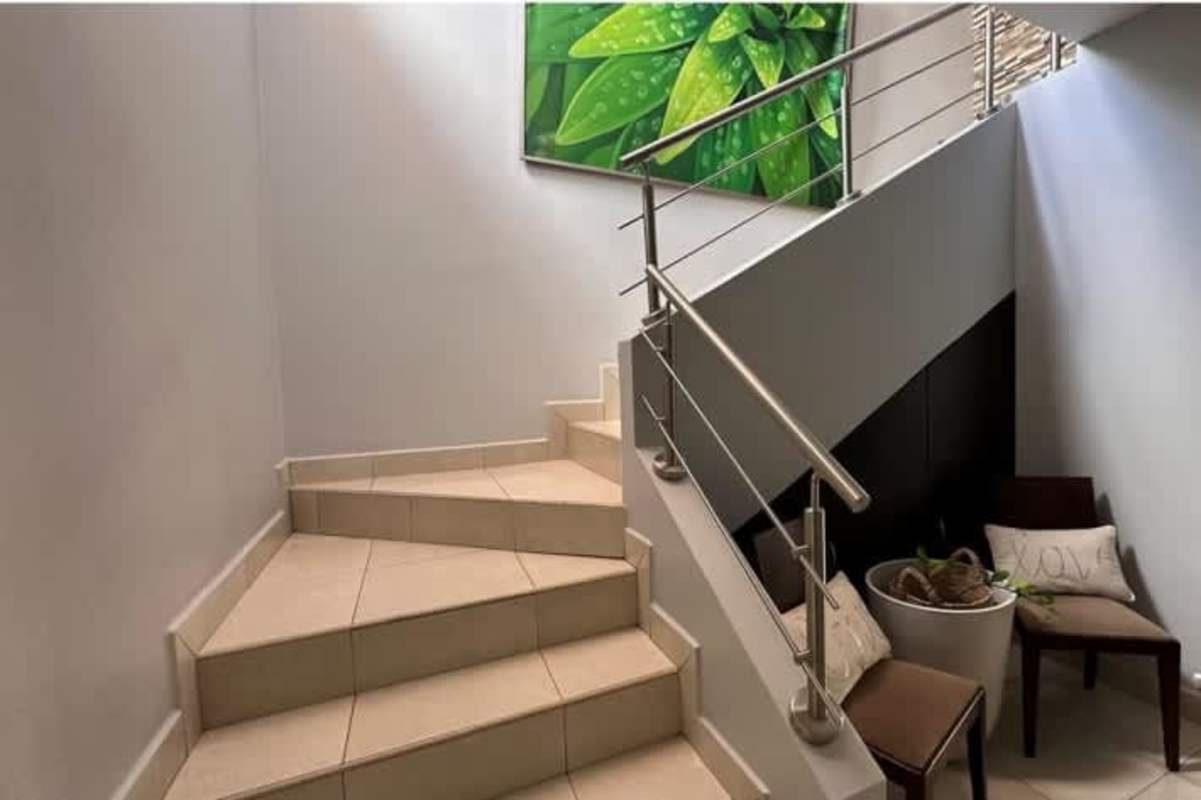 Contemporary bathroom with granite counters and glass shower in Villa Tivoli duplex Panama