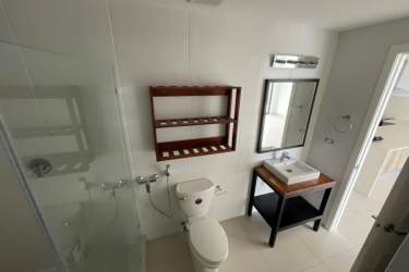 Minimalist bathroom glass shower modern sink PH Solaria Punta Caelo Panama