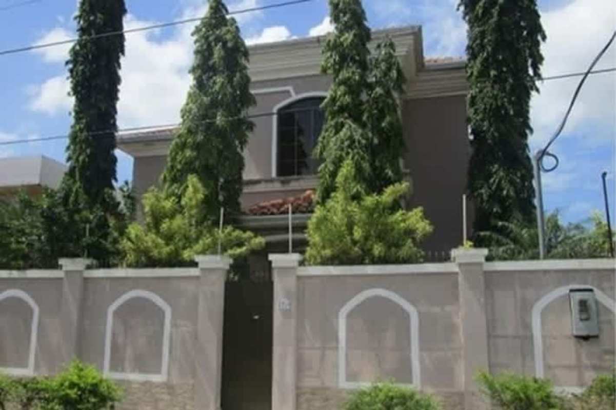 Mediterranean style two-story house with tile roof and gated garage in Chanis Parque Lefevre Panama City