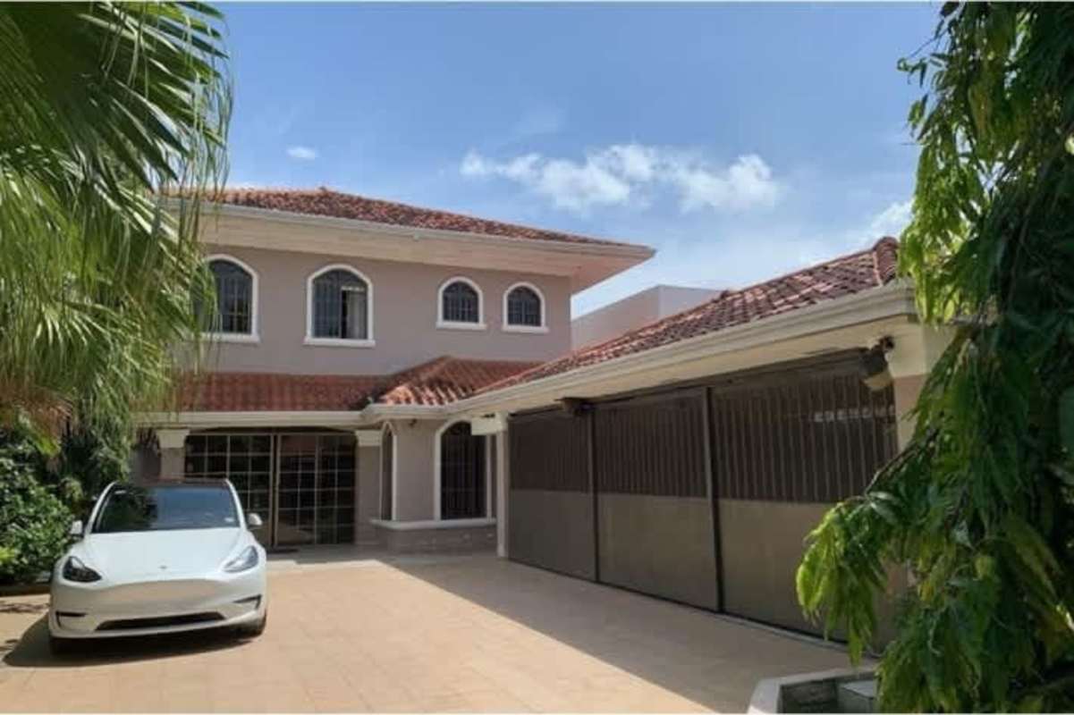 Landscaped garden with gazebo sitting area lush greenery Chanis Panama house for sale