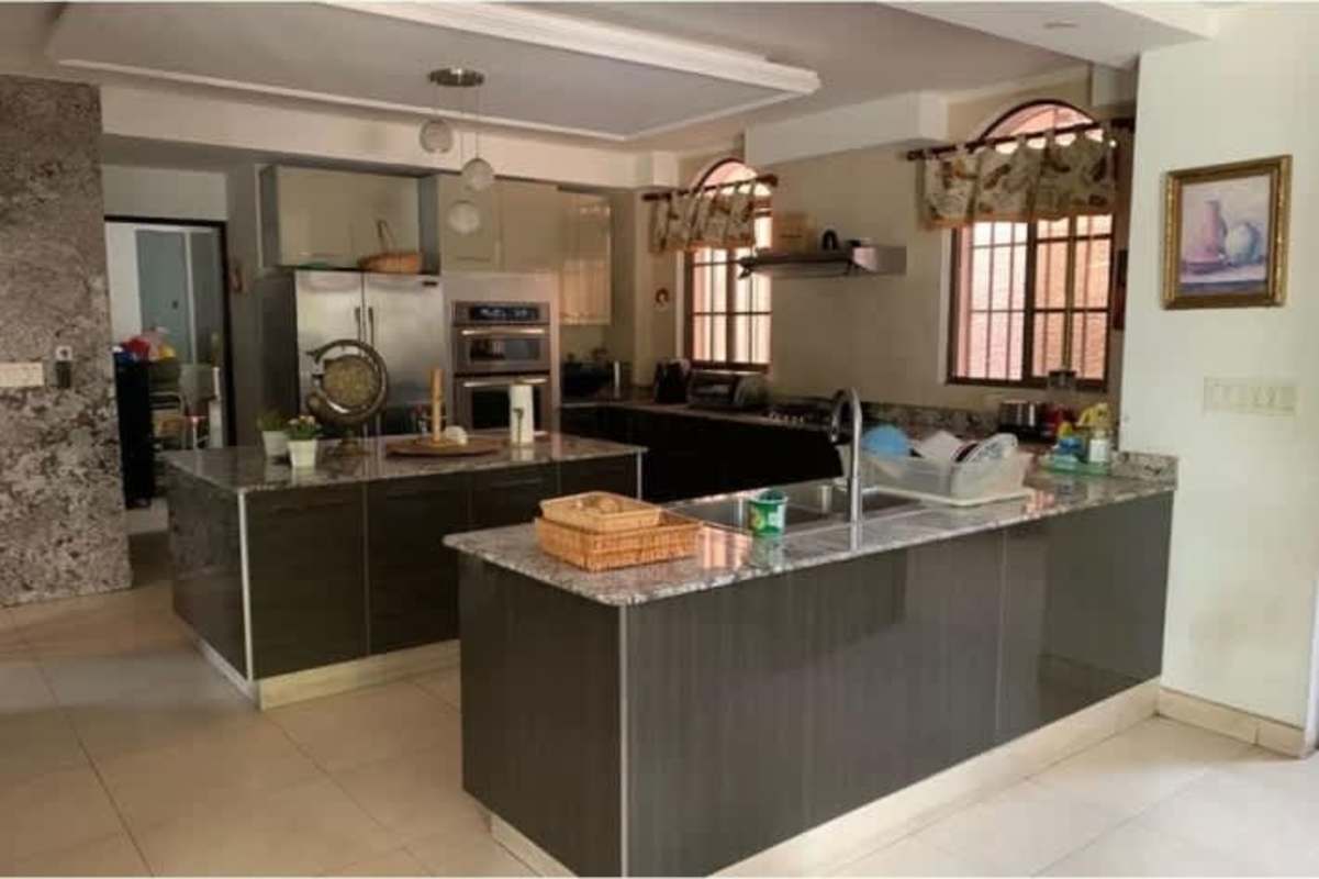 Modern kitchen interior with granite, double islands in house for sale Chanis Parque Lefevre Panama