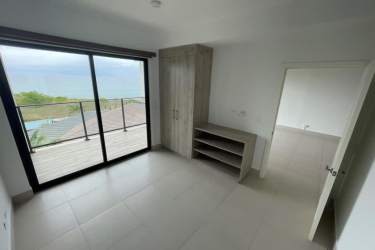 Master bedroom with sliding doors to oceanfront balcony PH Solaria Punta Caelo Panama