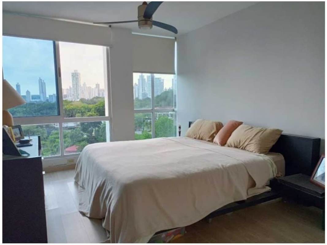 Modern bedroom featuring AC, closet, large windows with city views at PH Tower Park Panama City