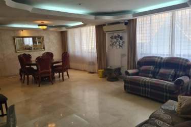 Additional living-dining room with traditional decor and ample space in Barrio Norte house Colón