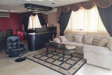 Bedroom with curtains, AC and traditional decor in spacious Barrio Norte house Colón Panama