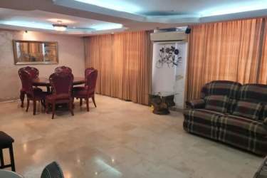 Spacious kitchen with cabinets, double counters, stove and fridge in Colón Barrio Norte house