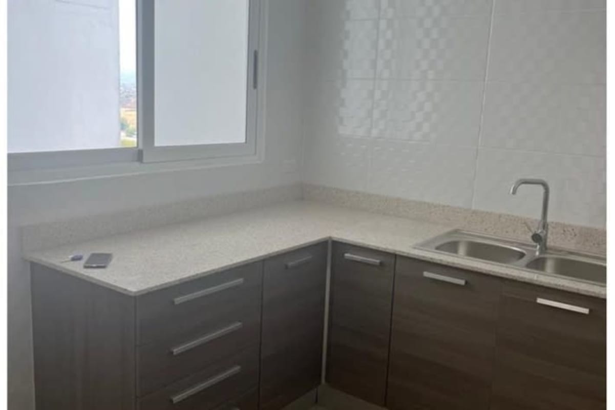 Bedroom with large window overlooking pool and skyline, modern built-in wardrobe in PH Kings Park Condado del Rey